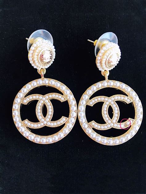 chanel earrings pearl logo|authentic chanel earrings.